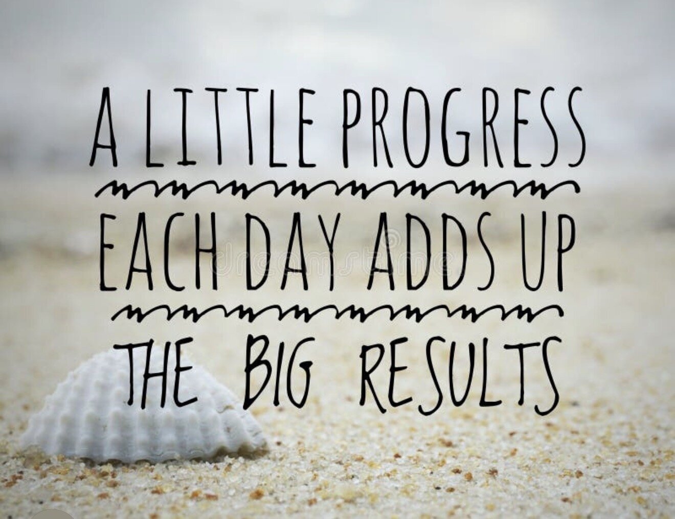 Hand lettered sign reading a little progress each day adds up to big results